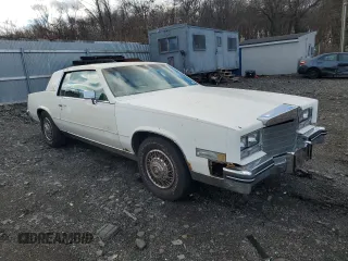 1985 Cadillac Eldorado z VIN 1G6EL578XFE673656, wystawiony jako Copart lot #86803334 z przebiegiem 94 396 mil mil oraz Tytuł czysty. Historia ofert i sprzedaży dostępna na DreamBid. Obrazek 4.