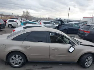 2005 Mercury Montego Luxury z VIN 1MEFM40185G611793, wystawiony jako IAAI lot #41125667 z przebiegiem Nie podano mil oraz . Historia ofert i sprzedaży dostępna na DreamBid. Obrazek 13.