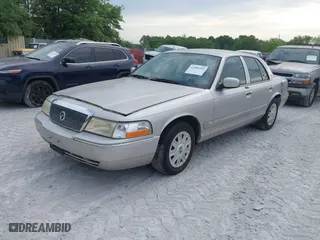 2004 Mercury Grand Marquis GS with VIN 2MEFM74W04X669087, listed as a IAAI auction lot 42090394 with 172,008 mi miles. Bid and sale history available at carsss.com. Image 2.