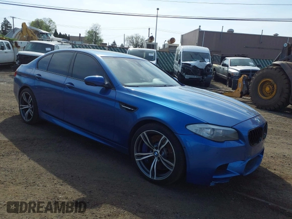 2013 BMW M5 with VIN WBSFV9C56DC774032, listed as a IAAI auction lot 42124754 with 55,409 mi miles. Bid and sale history available at carsss.com. Image 1.