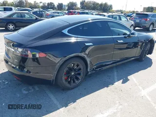 2017 Tesla Model S 100D with VIN 5YJSA1E21HF202591, listed as a IAAI auction lot 41983073 with 140,282 mi miles and . Bid and sale history available at DreamBid. Image 4.