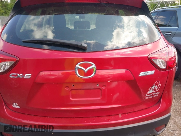 2015 Mazda CX-5 Sport with VIN JM3KE2BE8F0451014, listed as a IAAI auction lot 42536333 with 131,059 mi miles and . Bid and sale history available at DreamBid. Image 16.