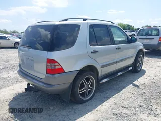 1998 Mercedes-Benz M-Class with VIN 4JGAB54E3WA031579, listed as a IAAI auction lot 42004335 with 156,898 mi miles. Bid and sale history available at carsss.com. Image 4.