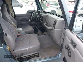 1998 Jeep Wrangler Sport with VIN 1J4FY19S8WP781437, listed as a IAAI auction lot 42096647 with 245,900 mi miles. Bid and sale history available at carsss.com. Image 5.