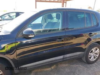 2012 Volkswagen Tiguan LE with VIN WVGAV7AX1CW557250, listed as a IAAI auction lot 42300694 with 122,310 mi miles and . Bid and sale history available at DreamBid. Image 14.