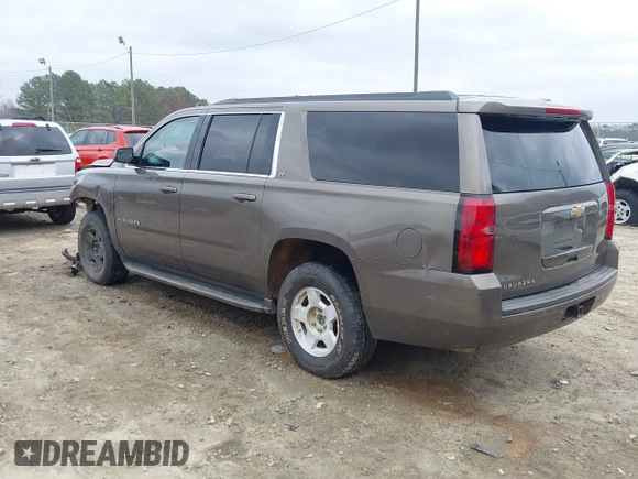 2015 Chevrolet Suburban LT z VIN 1GNSCJKC6FR675585, wystawiony jako IAAI lot #41510570 z przebiegiem 156 818 mil mil oraz . Historia ofert i sprzedaży dostępna na DreamBid. Obrazek 3.