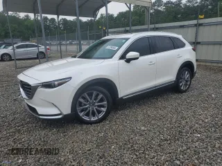 2023 Mazda CX-9 Grand Touring z VIN JM3TCBDY8P0641026, wystawiony jako Copart lot #57388665 z przebiegiem 20 033 mil mil oraz Szkoda całkowita • Salvage title. Historia ofert i sprzedaży dostępna na DreamBid. Obrazek 1.