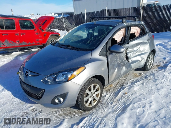 2013 Mazda 2 Touring z VIN JM1DE1LYXD0153291, wystawiony jako IAAI lot #41671574 z przebiegiem Nie podano mil oraz . Historia ofert i sprzedaży dostępna na DreamBid. Obrazek 2.