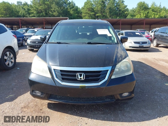 2010 Honda Odyssey Touring with VIN 5FNRL3H97AB104359, listed as a IAAI auction lot 42555872 with 233,952 mi miles and . Bid and sale history available at DreamBid. Image 6.