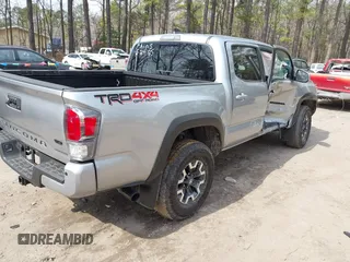 2022 Toyota Tacoma SR with VIN 3TMCZ5ANXNM497511, listed as a IAAI auction lot 41670710 with 26,277 mi miles and . Bid and sale history available at DreamBid. Image 4.
