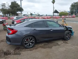 2018 Honda Civic Si z VIN 2HGFC1E59JH710458, wystawiony jako IAAI lot #42147386 z przebiegiem 89 650 mil mil oraz . Historia ofert i sprzedaży dostępna na DreamBid. Obrazek 14.