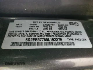 2009 Pontiac G8 z VIN 6G2ER57769L192376, wystawiony jako Copart lot #58634365 z przebiegiem 206 095 mil mil oraz Tytuł czysty. Historia ofert i sprzedaży dostępna na DreamBid. Obrazek 13.