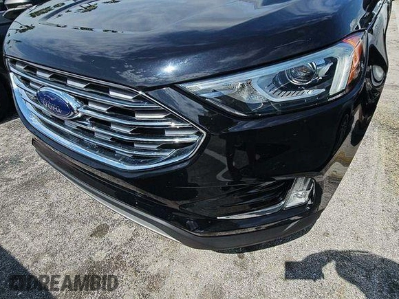 2020 Ford Edge Titanium z VIN 2FMPK3K91LBA60874, wystawiony jako IAAI lot #42470865 z przebiegiem 94 048 mil mil oraz . Historia ofert i sprzedaży dostępna na DreamBid. Obrazek 3.