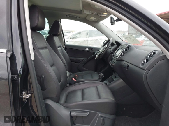 2016 Volkswagen Tiguan S with VIN WVGBV7AX9GW566451, listed as a IAAI auction lot 41393999 with 51,616 mi miles and . Bid and sale history available at DreamBid. Image 5.