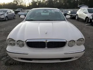 2004 Jaguar XJ with VIN SAJWA71C14SG16264, listed as a Copart auction lot 83251554 with 267,493 mi miles and Salvage Title. Bid and sale history available at carsss.com. Image 5.