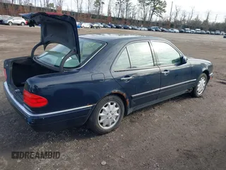 1999 Mercedes-Benz E-Class with VIN WDBJF65H1XA817789, listed as a IAAI auction lot 41818511 with 999,999 mi miles. Bid and sale history available at carsss.com. Image 4.