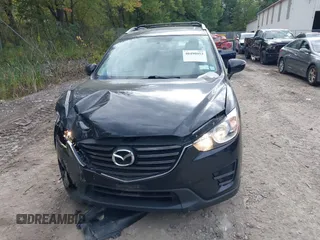 2016 Mazda CX-5 Sport with VIN JM3KE2BE8G0804398, listed as a IAAI auction lot 40490953 with 116,279 mi miles and . Bid and sale history available at DreamBid. Image 11.