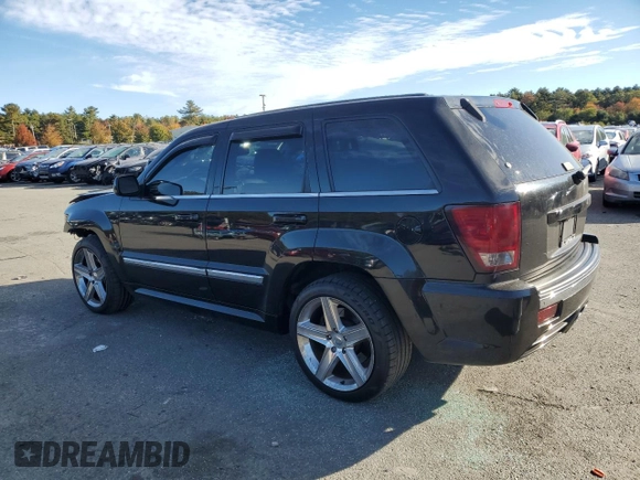 2008 Jeep Grand Cherokee SRT-8 with VIN 1J8HR78368C152318, listed as a Copart auction lot 74203604 with 157,840 mi miles and Salvage Title. Bid and sale history available at carsss.com. Image 2.