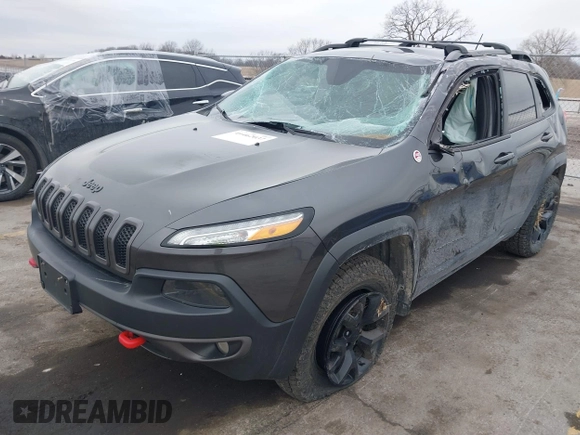 2015 Jeep Cherokee Trailhawk with VIN 1C4PJMBS0FW668730, listed as a IAAI auction lot 41462037 with 83,454 mi miles. Bid and sale history available at carsss.com. Image 2.