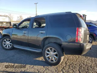 2013 GMC Yukon Denali with VIN 1GKS1EEF0DR205906, listed as a Copart auction lot 87969385 with 128,283 mi miles and Salvage Title. Bid and sale history available at carsss.com. Image 2.