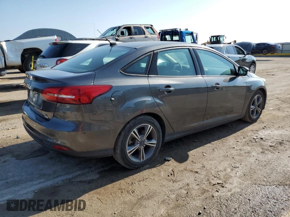 2016 Ford Focus SE with VIN 1FADP3FE1GL253425, listed as a Copart auction lot 64285965 with 105,309 mi miles and Salvage title. Bid and sale history available at DreamBid. Image 3.
