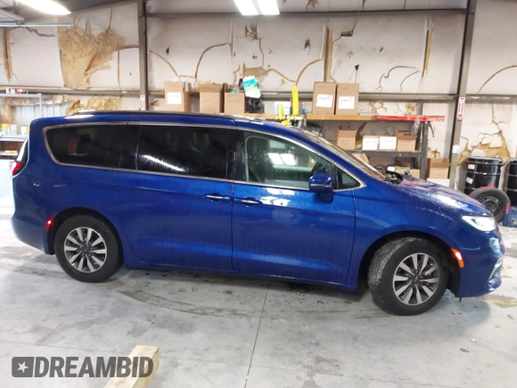 2021 Chrysler Pacifica Touring L z VIN 2C4RC1BGXMR503108, wystawiony jako IAAI lot #41914136 z przebiegiem 98 685 mil mil oraz . Historia ofert i sprzedaży dostępna na DreamBid. Obrazek 13.