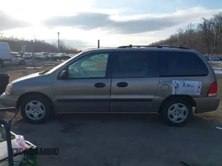 2005 Ford Freestar SE z VIN 2FMZA51645BA05742, wystawiony jako IAAI lot #41429194 z przebiegiem 145 415 mil mil oraz . Historia ofert i sprzedaży dostępna na DreamBid. Obrazek 14.