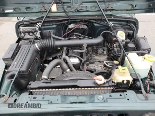 1999 Jeep Wrangler Sport z VIN 1J4FY19SXXP427968, wystawiony jako Copart lot #50102855 z przebiegiem 174 381 mil mil oraz Czysty tytuł • Clean title. Historia ofert i sprzedaży dostępna na DreamBid. Obrazek 11.