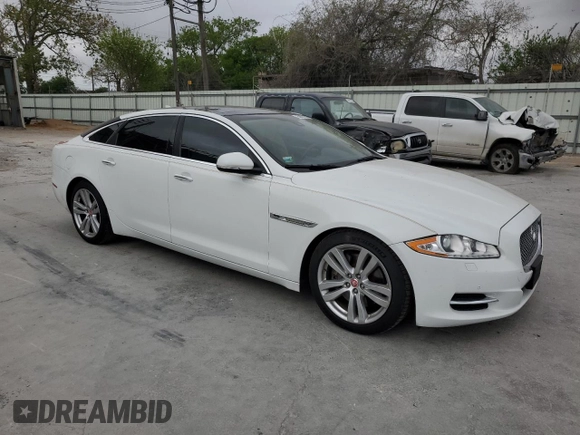 2014 Jaguar XJ Portfolio with VIN SAJWJ2GD6E8V65987, listed as a Copart auction lot 50091105 with 136,080 mi miles and Clean title. Bid and sale history available at DreamBid. Image 4.