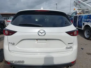 2020 Mazda CX-5 Touring z VIN JM3KFBCM2L0786784, wystawiony jako IAAI lot #42127457 z przebiegiem 62 665 mil mil oraz . Historia ofert i sprzedaży dostępna na DreamBid. Obrazek 16.