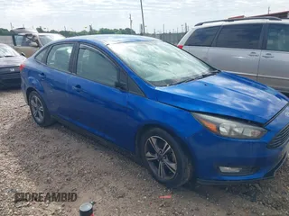 2018 Ford Focus SE z VIN 1FADP3F24JL214504, wystawiony jako IAAI lot #42132599 z przebiegiem 125 512 mil mil oraz . Historia ofert i sprzedaży dostępna na DreamBid. Obrazek 1.