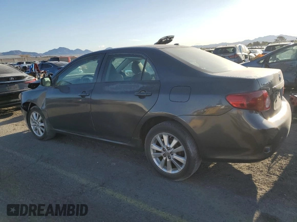 2010 Toyota Corolla with VIN 2T1BU4EE1AC363990, listed as a Copart auction lot 52001595 with 244,000 mi miles and Salvage title. Bid and sale history available at DreamBid. Image 2.