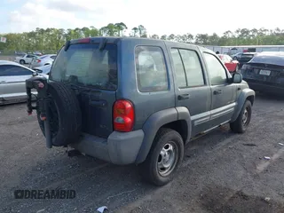 2002 Jeep Liberty Sport with VIN 1J4GL48K32W324864, listed as a IAAI auction lot 41962179 with 147,988 mi miles. Bid and sale history available at carsss.com. Image 4.