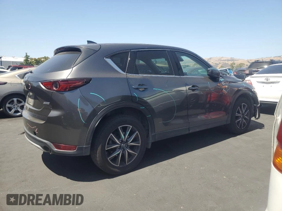 2018 Mazda CX-5 Grand Touring with VIN JM3KFADM3J1389911, listed as a Copart auction lot 60530295 with 103,177 mi miles and Salvage title. Bid and sale history available at DreamBid. Image 3.