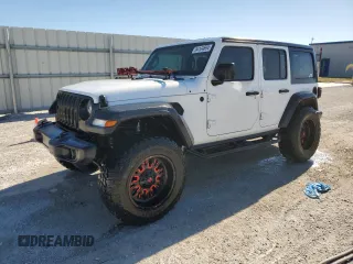 2020 Jeep Wrangler Unlimited Willys with VIN 1C4HJXDG7LW238235, listed as a Copart auction lot 84144694 with 56,606 mi miles and Salvage title. Bid and sale history available at DreamBid. Image 1.