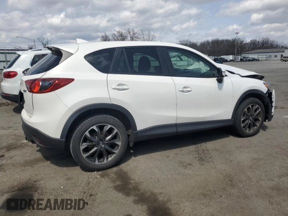 2016 Mazda CX-5 Grand Touring z VIN JM3KE2DY9G0645141, wystawiony jako Copart lot #50989635 z przebiegiem 123 898 mil mil oraz Szkoda całkowita • Salvage title. Historia ofert i sprzedaży dostępna na DreamBid. Obrazek 3.