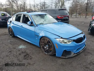 2017 BMW M3 z VIN WBS8M9C5XH5G42299, wystawiony jako IAAI lot #42017927 z przebiegiem 39 846 mil mil oraz . Historia ofert i sprzedaży dostępna na DreamBid. Obrazek 1.