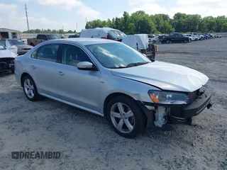 2015 Volkswagen Passat Wolfsburg Edition with VIN 1VWAT7A3XFC116985, listed as a IAAI auction lot 42311657 with 133,442 mi miles and . Bid and sale history available at DreamBid. Image 1.