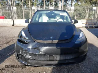 2023 Tesla Model Y Long Range z VIN 7SAYGDEE9PF637042, wystawiony jako IAAI lot #41969086 z przebiegiem 25 524 mil mil oraz . Historia ofert i sprzedaży dostępna na DreamBid. Obrazek 12.