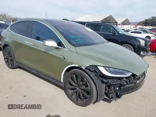 2018 Tesla Model X 75D with VIN 5YJXCBE23JF135990, listed as a IAAI auction lot 41686900 with 83,011 mi miles. Bid and sale history available at carsss.com. Image 1.