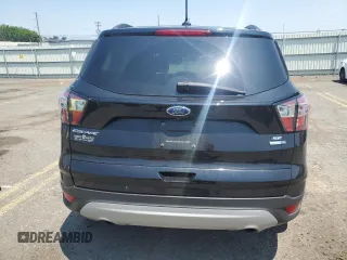 2018 Ford Escape SE z VIN 1FMCU9GD3JUA78244, wystawiony jako Copart lot #59508955 z przebiegiem 108 273 mil mil oraz Szkoda całkowita • Salvage title. Historia ofert i sprzedaży dostępna na DreamBid. Obrazek 6.