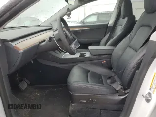 2023 Tesla Model Y Long Range z VIN 7SAYGAEE0PF693613, wystawiony jako Copart lot #54452895 z przebiegiem 19 574 mil mil oraz Szkoda całkowita • Salvage title. Historia ofert i sprzedaży dostępna na DreamBid. Obrazek 7.