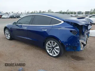 2020 Tesla Model 3 Standard Range Plus with VIN 5YJ3E1EA1LF802648, listed as a IAAI auction lot 42208034 with 27,231 mi miles and . Bid and sale history available at DreamBid. Image 3.