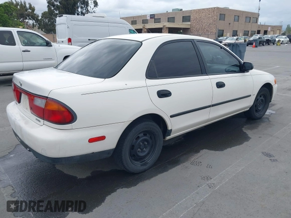 1997 Mazda Protege DX with VIN JM1BC1417V0156858, listed as a IAAI auction lot 42118339 with 187,673 mi miles and . Bid and sale history available at DreamBid. Image 4.