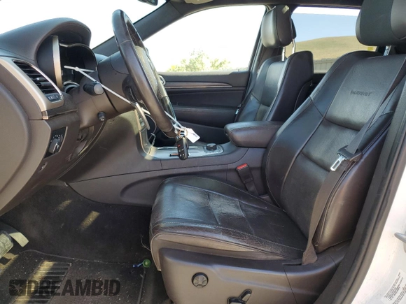 2014 Jeep Grand Cherokee Summit with VIN 1C4RJFJTXEC134150, listed as a Copart auction lot 61859265 with 159,262 mi miles and Salvage title. Bid and sale history available at DreamBid. Image 7.