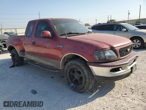 1997 Ford F-150 XL with VIN 1FTDX0721VKC14947, listed as a Copart auction lot 74887414 with 157,811 mi miles and Salvage title. Bid and sale history available at DreamBid. Image 4.