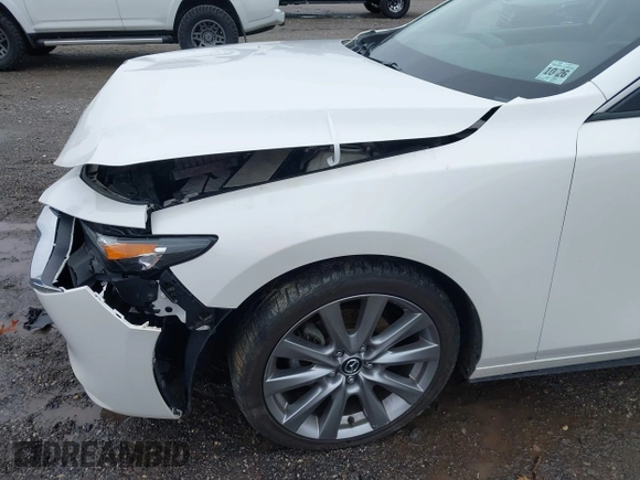 2021 Mazda 3 Preferred z VIN 3MZBPBCL0MM250862, wystawiony jako IAAI lot #42318612 z przebiegiem 86 056 mil mil oraz . Historia ofert i sprzedaży dostępna na DreamBid. Obrazek 17.