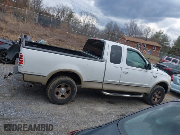 1999 Ford F-150 XL with VIN 1FTRX18LXXKA75357, listed as a IAAI auction lot 41630371 with 202,021 mi miles. Bid and sale history available at carsss.com. Image 14.