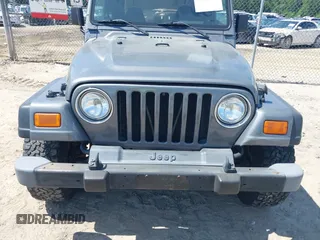 2002 Jeep Wrangler Sport z VIN 1J4FA49S62P731507, wystawiony jako IAAI lot #42584222 z przebiegiem 206 661 mil mil oraz . Historia ofert i sprzedaży dostępna na DreamBid. Obrazek 6.
