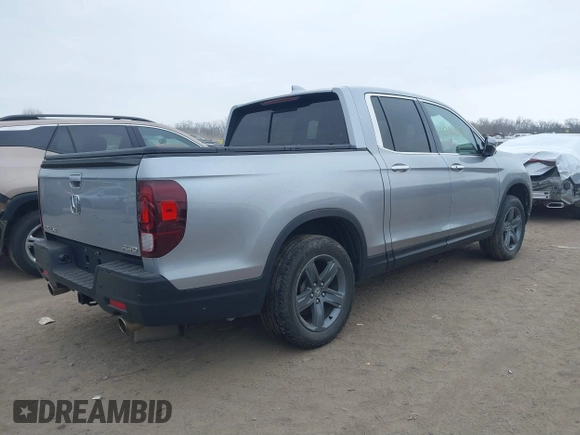2021 Honda Ridgeline RTL-E with VIN 5FPYK3F79MB010091, listed as a IAAI auction lot 41386318 with 37,996 mi miles and . Bid and sale history available at DreamBid. Image 4.